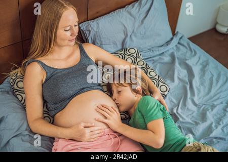 Premium Photo  Beautiful young pregnant woman and little kid boy