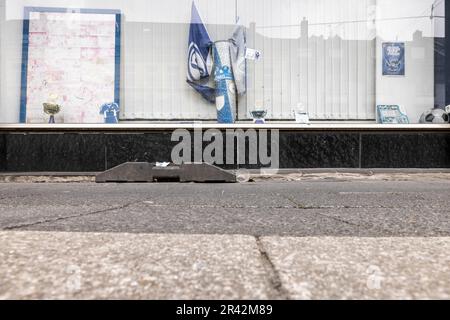 Gelsenkirchen, Germany. 25th May, 2023. A shop window with faded photos from good Schalk times, some flags and small trophies on the Schalker Meile in Gelsenkirchen. (to dpa "Expert: Relegation would be particularly bitter for Gelsenkirchen") Credit: Christoph Reichwein/dpa/17�Թ����� Live News Stock Photo
