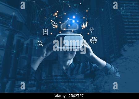 Businesswoman wearing VR glasses and accessing the Cloud Computing Technology Internet Storage Network Concept And a large database big data Through i Stock Photo