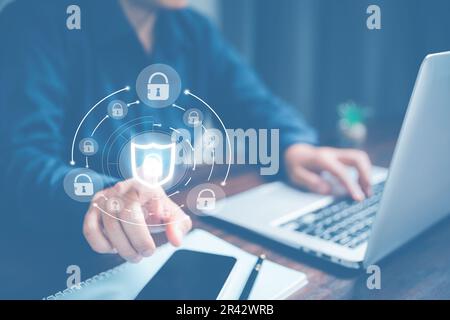 Cybersecurity and privacy concepts to protect data. Lock icon and internet network security technology. Businesswoman protecting personal data on lapt Stock Photo
