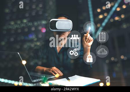 Businesswoman wearing VR glasses and accessing the Cloud Computing Technology Internet Storage Network Concept And a large database big data Through i Stock Photo