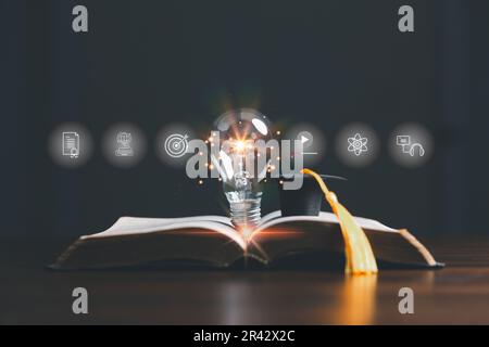 Lightbulb on book with education e-learning icons, Internet education course degree, study knowledge to creative thinking idea and solving solution. E Stock Photo