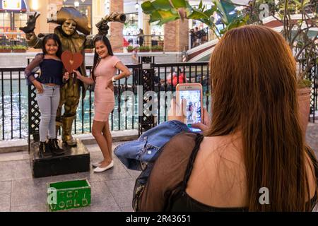 Family posing with Carnival costumes, Venice Grand Canal Mall, Taguig City, Manila, Philippines Stock Photo