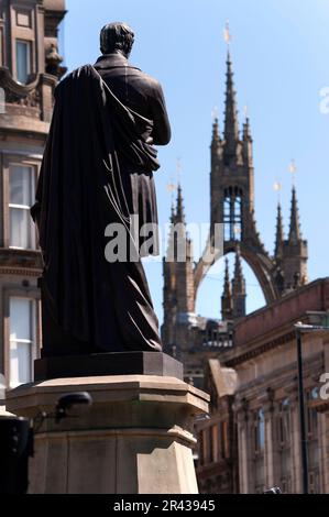 Statue of  George Stephenson with St Nicholas cathedral behind, Newcastle upon Tyne Stock Photo