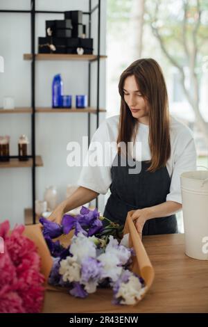 Owner working at flower shop - stock photo Stock Photo