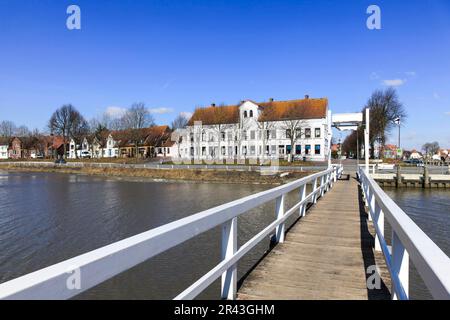 White bridge over the peat harbour in Toenning Stock Photo