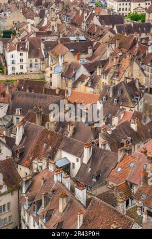 View from the tower of the Collegiate Church of Notre Dame of the houses and roofs in the historic centre, town of Dole, Jura Stock Photo