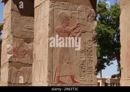 Ancient egyptian carvings and wall reliefs at Karnak temple, Luxor, Egypt Stock Photo