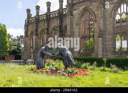 Liverpool, united kingdom May, 16, 2023 The sculpture All Together Now by Andy Edwards outside the bombed out church of St John's in Liverpool Stock Photo