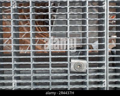 Gray grille transparent floor in platform construction with high resistance to deformation even under high loads Galvanized steel Stock Photo