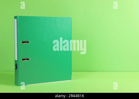 Office folder on light green background, space for text Stock Photo