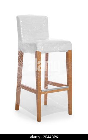 Chair wrapped in stretch film on white background Stock Photo