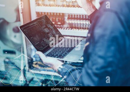 Electricity engineer work using AI computer software control monitor power consumption saving energy concept Stock Photo