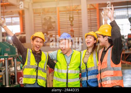 Group of engineer worker team greeting cheerful happy smiling laughing together. Stock Photo