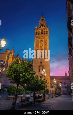 Seville Cathedral at Plaza Virgen de Los Reyes Square at sunset - Seville, Andalusia, Spain Stock Photo