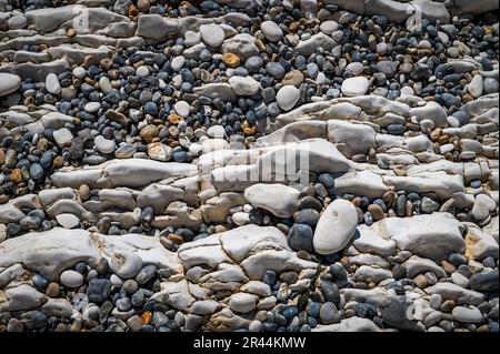 Pebbles and chalk rocks on a beach in Dorset for wall art Stock Photo