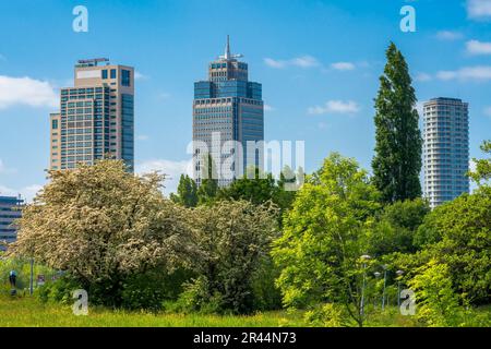 Office buildings, Rembrandt Tower in Amsterdam seen from the park on a sunny spring day Stock Photo