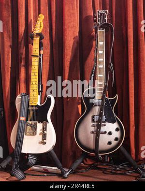 Guitars are ready for being played at the stage of Night and Day, 26 Oldham Street, Northern Quarter, Manchester-Uk. Stock Photo
