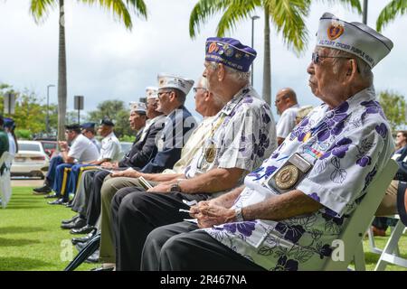 U.S. service members and veterans attend a ceremony for the 50th anniversary of Operation Homecoming at Joint Base Pearl Harbor-Hickam, Hawaii, March 28, 2023. Between Feb. 12 and April 1, 1973, 591 Prisoner’s of War were released from captivity by the North Vietnam government and flown from Clark Air Base, Philippines, to Hickam Field which marked the end of the Vietnam War. Stock Photo