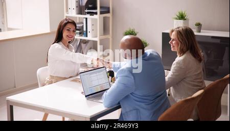 Businesspeople Shaking Hands After Interview In Office Stock Photo