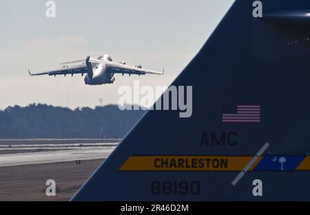 U.S. Air Force C-17 Globemaster III aircraft takes off during a mission generation exercise at Joint Base Charleston, South Carolina, Jan. 5, 2023. The 437th Airlift Wing, along with Army, Marine, and Air Force units, exercised the seamless integration of warfighting capabilities. Stock Photo