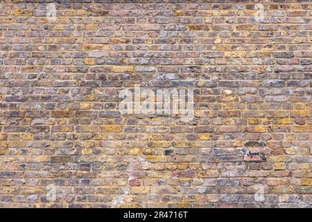 Old weathered brick wall texture. Grunge urban street brick wall Stock Photo