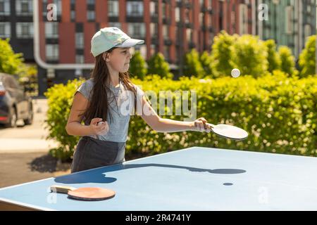 Cute Kids Playing Table Tennis Sports with Racket and Ball of Ping Pong  Game Match in Flat Cartoon Hand Drawn Templates Illustration Stock Photo -  Alamy