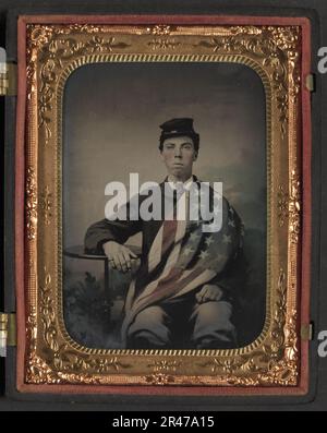 Unidentified soldier in Union uniform with American flag draped over his shoulder and lap Stock Photo