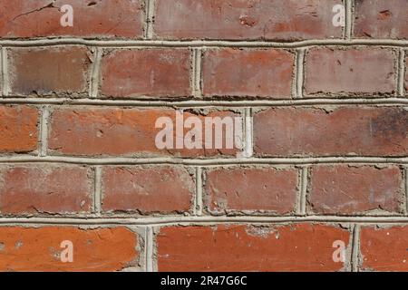Brick wall of red bricks, masonry close-up Stock Photo