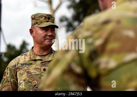 U.S. Army Lt. Col. Donald Lipscomb, commander of the California Army National Guard’s 185th Military Police Battalion, 49th Military Police Brigade, talks to his command team at the Randall Road Debris Basin, Jan. 13, 2023, in Montecito, California, during a 649th Engineer Company mission to reroute the water flow as part of the state’s storm response. The basin is in the same area where a deadly mudflow hit in 2018. The engineers are supporting the Santa Barbara County Office of Emergency Management through the California Governor's Office of Emergency Services. Stock Photo