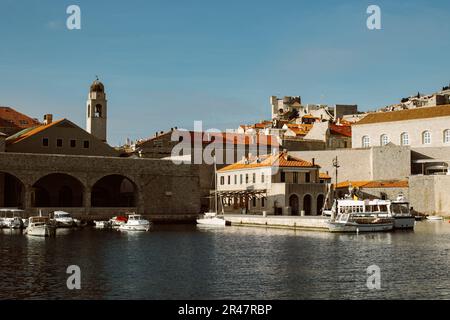 Amazing view of Dubrovnik and the boat in a marina on a sunny day. Travel destination in Croatia. Stock Photo