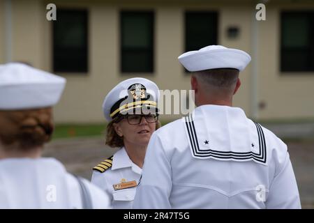 Captain Kimberly Toone, commanding officer Navy Medicine Operational Training Command (NMOTC), conducts a dress whites uniform inspection, Apr. 07. Navy Medicine Operational Training Command (NMOTC) is comprised of six nationwide detachments that offer specialized medical training in the fields of aviation, aviation survival, surface and undersea warfare, expeditionary and special operations medicine. Stock Photo