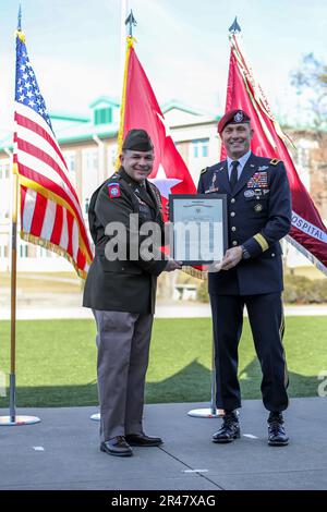 Col. Edgardo Ramirez, commander of the 14th Field Hospital, receives a ...