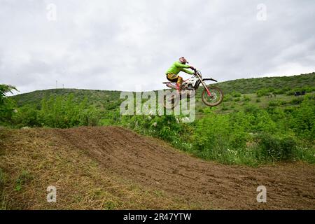 Orman, Macedonia, May 14 2023. In rainy weather and a muddy track, motorcycle racers competed in several categories in difficult conditions. Stock Photo