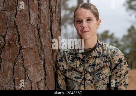 U.S. Marine Corps Sgt. Danielle Grimshaw, an intelligence specialist with 8th Engineer Support Battalion, Combat Logistics Regiment 27, 2nd Marine Logistics Group (MLG), poses for a photo on Camp Lejeune, North Carolina, Jan. 25, 2023. Grimshaw won the 2nd MLG noncommissioned officer of the Year for her work ethic and determination in the workplace. Stock Photo