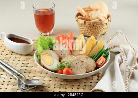 Selat Solo Galantine, Javanese Steak with Meatloaf and Steamed Vegetable, Served with Sweet Sauce Stock Photo