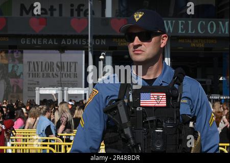 East Rutherford, USA. 26th May, 2023. A New Jersey State Trooper looks on as fans file through the MetLife Stadium security to attend a Taylor Swift concert, East Rutherford, NJ, May 26, 2023. (Photo by Anthony Behar/Sipa USA) Credit: Sipa USA/Alamy Live News Stock Photo
