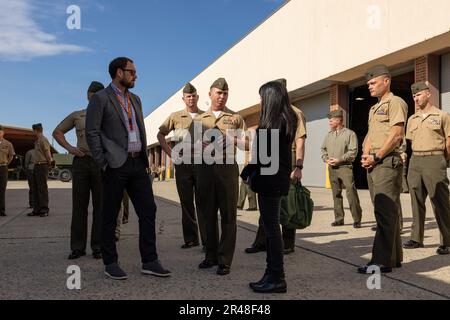 Mr. Patrick Nevins, left, and Ms. Sapna Sharma, right, both staff members of the House Armed Services Committee, discuss unit capabilities with leaders from 2nd Marine Division, during a staff tour during a house armed services committee staff member visit aboard Marine Corps Base Camp Lejeune, North Carolina, March 31, 2023. Mr. Patrick Nevins and Ms. Sapna Sharma, professional staff members of the House Armed Services Committee, visited II MEF and major subordinate commands to discuss amphibious readiness and shipping, force posture and other topics related to the Commandant Force Design 203 Stock Photo