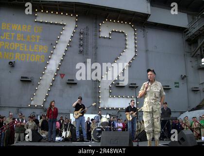 US Navy General Tommy Franks speaks with Sailors aboard Abraham Lincoln Stock Photo