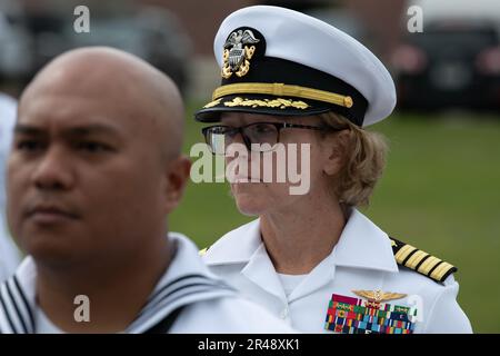 Captain Kimberly Toone, commanding officer Navy Medicine Operational Training Command (NMOTC), inspects a Sailor during a dress whites uniform inspection, Apr. 07. Navy Medicine Operational Training Command (NMOTC) is comprised of six nationwide detachments that offer specialized medical training in the fields of aviation, aviation survival, surface and undersea warfare, expeditionary and special operations medicine. Stock Photo