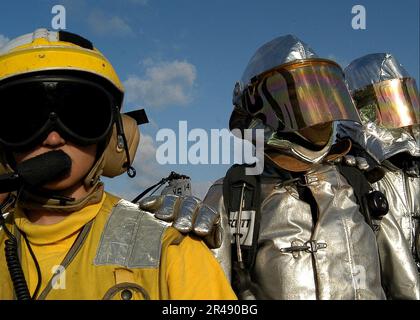 US Navy Sailors assigned to the Crash and Salvage Team aboard Kearsarge ...