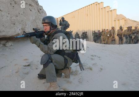 US Navy Naval Special Warfare team members conduct a training operation from a forward operating location Stock Photo