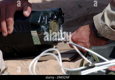 US Navy Members of Underwater Construction Team Two (UCT-2) prepares for an explosives training on a remote area Stock Photo