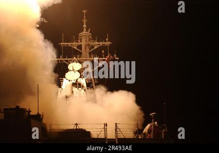 US Navy Tomahawk Land Attack Missiles (TLAM) launch from the ship's forward and aft MK-41 vertical launch systems (VLS) aboard the guided missile destroyer USS Donald Cook (DDG 75) Stock Photo