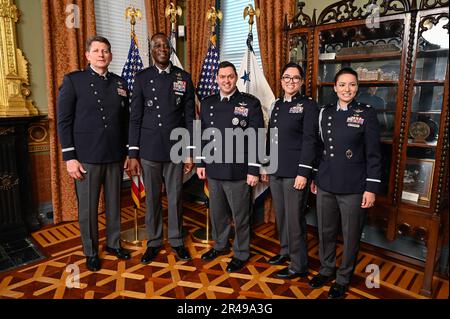 Space Force Brig. Gen. Jacob Middleton, second from left, poses with Vice Chief of Space Operations Gen. David Thompson, left, Chief of Space Operations Gen. Chance Saltzman, center, and staff during his promotion at the Eisenhower Executive Office Building, Washington, D.C., April 4, 2023. Middleton is the director of national security space policy for the National Space Council. Stock Photo