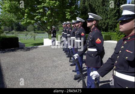 US Navy The U.S. Marine firing detail stands at parade rest during a Memorial Day ceremony Stock Photo