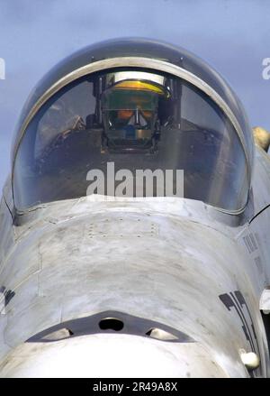 US Navy A pilot looks through his Heads-Up Display (HUD) while sitting in his F-A-18C Hornet aboard the aircraft carrier USS Constellation (CV 64) Stock Photo