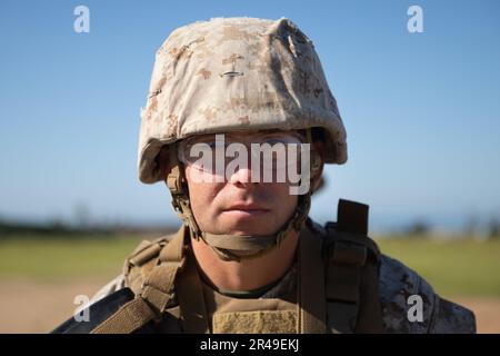 U.S. Marine Corps recruit Matthew Williams with Kilo Company, 3rd Recruit Training Battalion, waits to fire during a table two course of fire at Marine Corps Base Camp Pendleton, Calif. March 28, 2023. All recruits participated in the table two rifle qualification course during the third phase of recruit training. Williams was recruited out of Recruiting Station San Antonio, Texas. Stock Photo