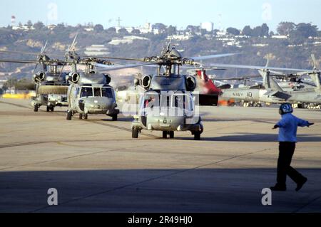 US Navy SH-60 Seahawk helicopters taxi down the flight line Stock Photo