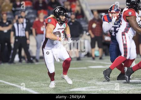 May 26, 2023: Ottawa Redblacks quarterback Nick Arbuckle (9) looks to throw  while Montreal Alouettes defensive lineman Nick Heninger (43) rushes the  passer during the CFL preseason game between Montreal Alouettes and